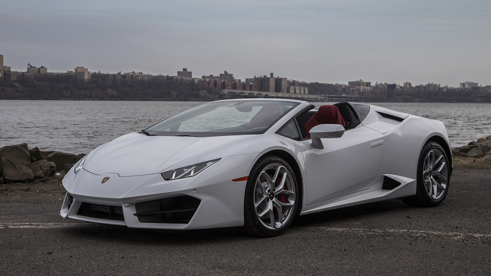 Image of a 2019 Lamborghini Huracan Spyder on a waterfront.